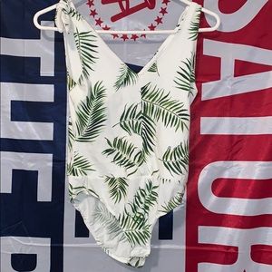 body suit with leafs on it